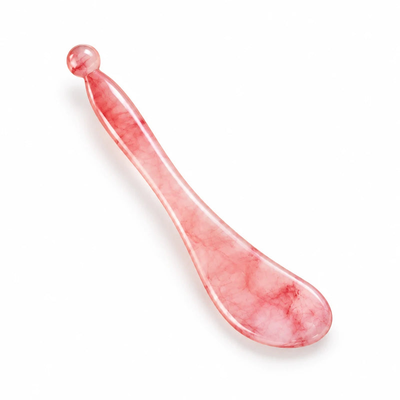 Cellovia sakura pink natural resin cooling eye massage wand with a smooth, ergonomic design for facial skincare.